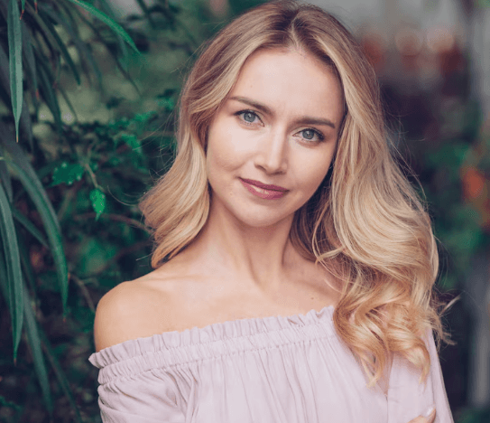 Elegant woman enjoying a rooftop evening